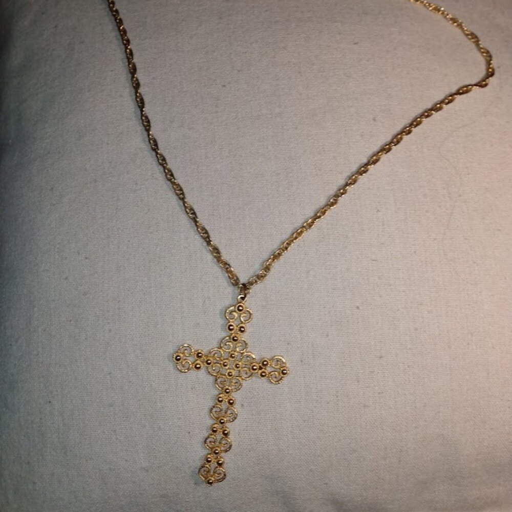 Large gold tone filigree cross with chain necklace.